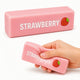 Pink strawberry-scented eraser with a hand holding one, on a white background