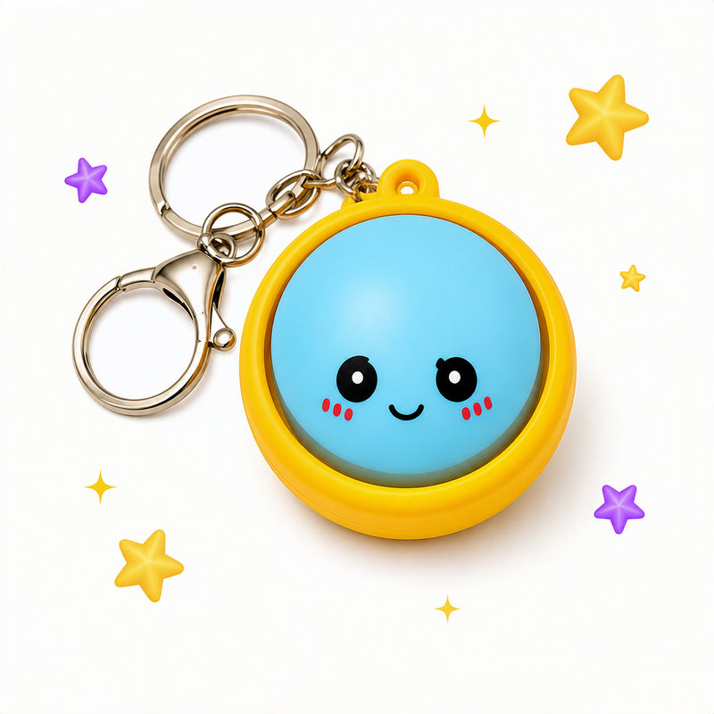 Keychain with a blue round face and yellow frame on a white background with decorative stars.