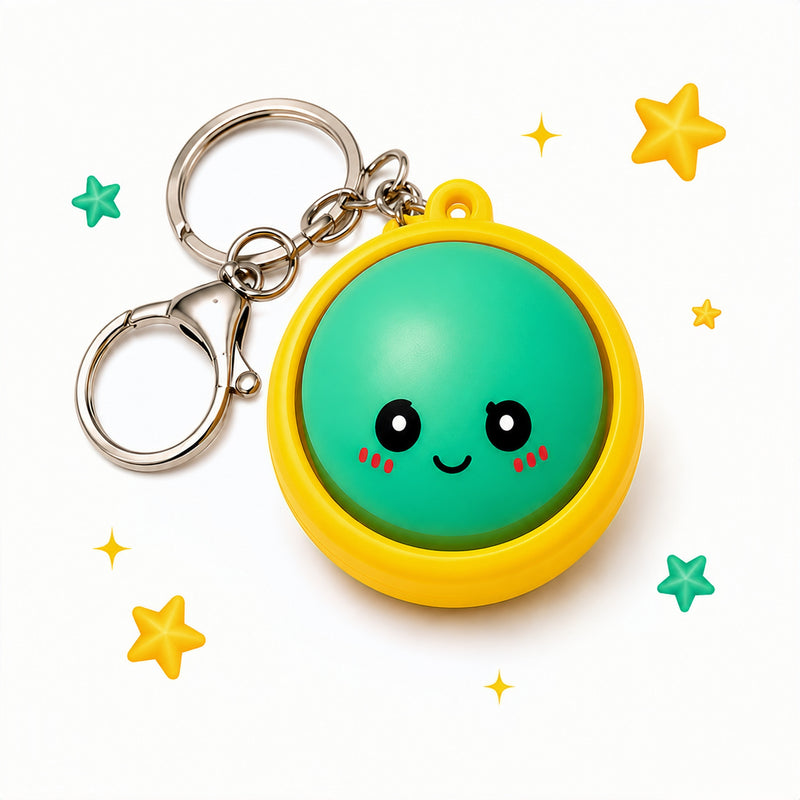 Keychain with a green round face and yellow border on a white background with stars.