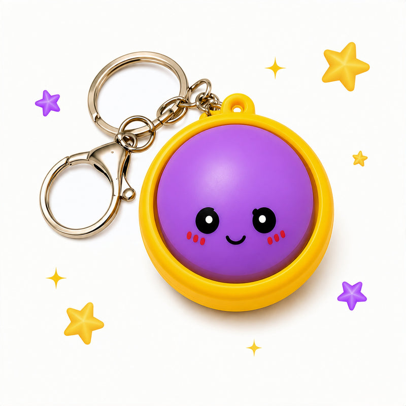 Keychain with a purple ball character on a white background with stars
