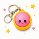 Keychain with a pink round character on a white background with stars