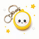 Keychain with a smiley face design on a white background