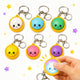 Set of colorful keychains with smiling faces on a white background
