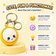 Keychain with a cartoon character on a yellow background, featuring text about its functions.