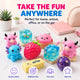 Collection of colorful desk toys and items with text 'Take the Fun Anywhere' on a desk setup.