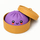 Purple dumpling with a smiling face in a yellow container on a white background