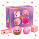Pink squishy toys with a box labeled 'Squishy Fun Pack' on a white background.