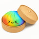 Colorful textured ball with a smiley face in an open tan container on a white background