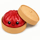 Red glittery bun with a smiling face in a tan container on a white background