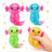 Four colorful axolotl-shaped toys with a hand holding one, on a white background.