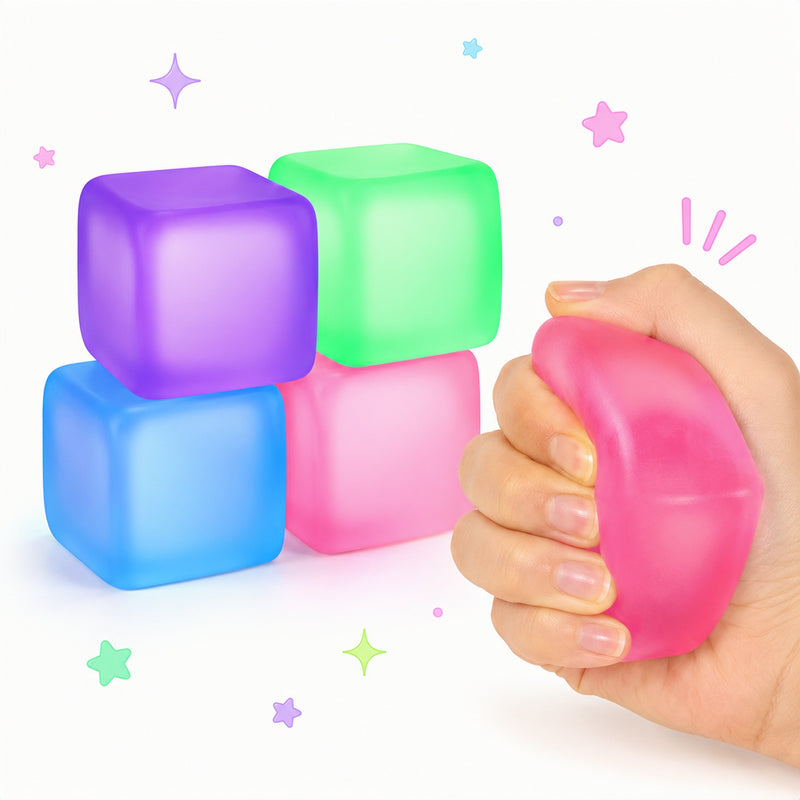 Colorful cube-shaped stress relievers with a hand squeezing a pink one on a white background.