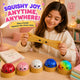 Girl playing with squishy toys on a table, with text 'Squishy Joy, Anytime, Anywhere!'